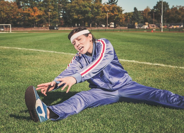 Female Athlete trying to stretch